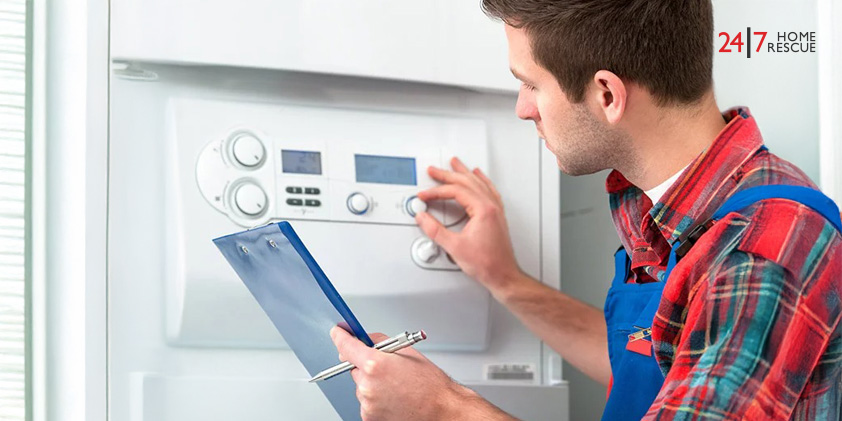 Engineer standing near a boiler