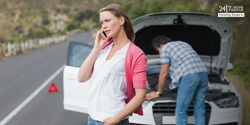 A woman is calling roadside assistance to her cover provider after a car breakdown