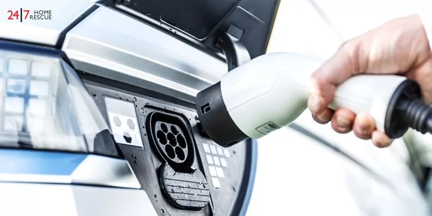 The driver of the electric car remove the electrical connector