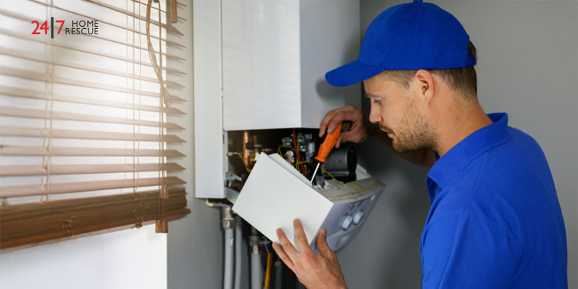 Engineer working on gas boiler repair service in a home.