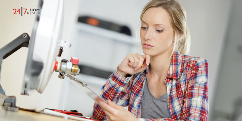 Women analyzing boiler service instructions for a heating system