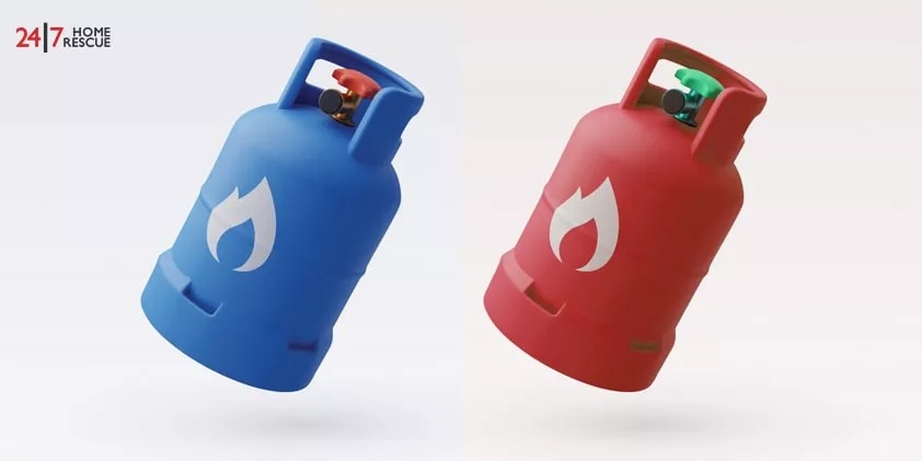 Two gas cylinders, one blue and one red, with a flame logo on them