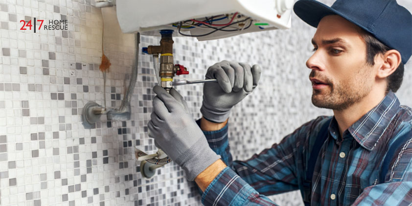 Close-up of a technician's hand using a wrench to repair an boiler.