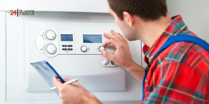 Technician performing maintenance on a gas boiler