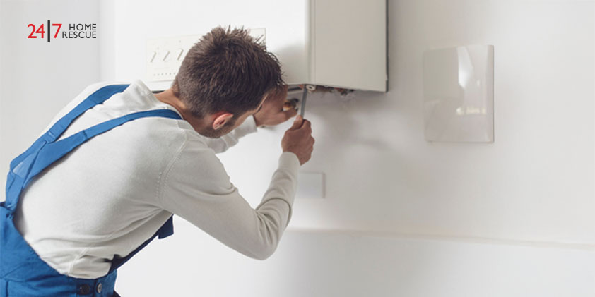 Engineer performing boiler inspection and pipe maintenance