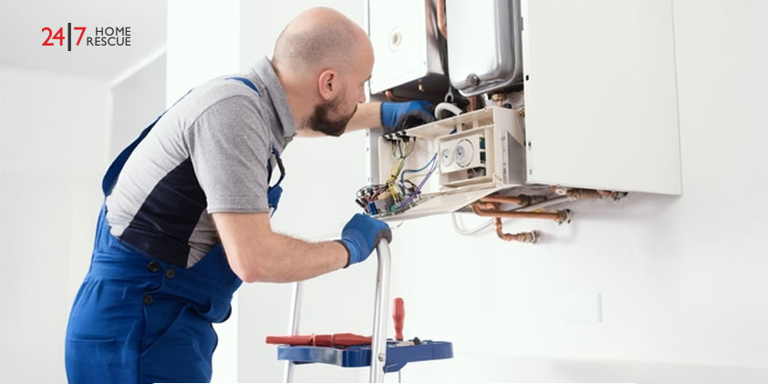 Qualified engineer performing professional maintenance on a home gas boiler
