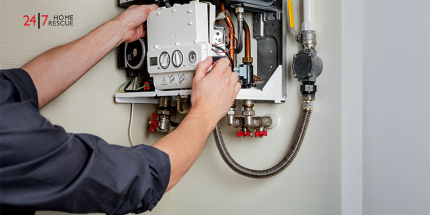 Engineer repairing a gas boiler