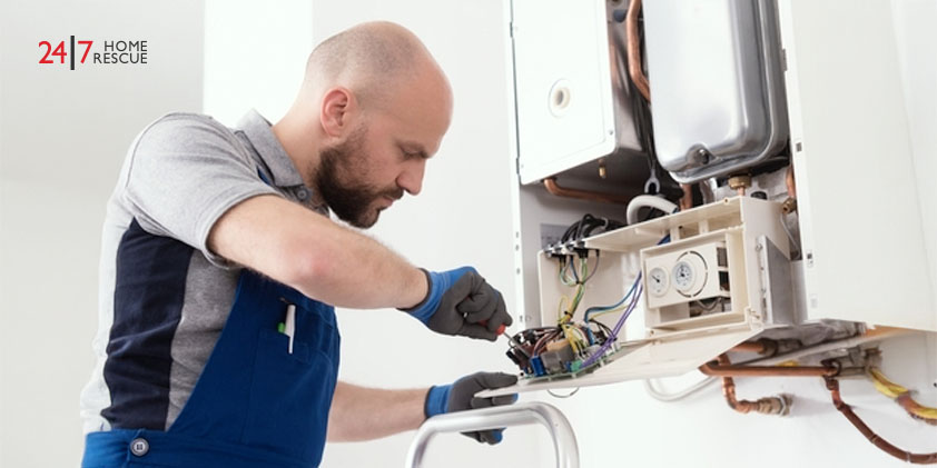 Professional qualified engineer servicing a natural gas boiler at home