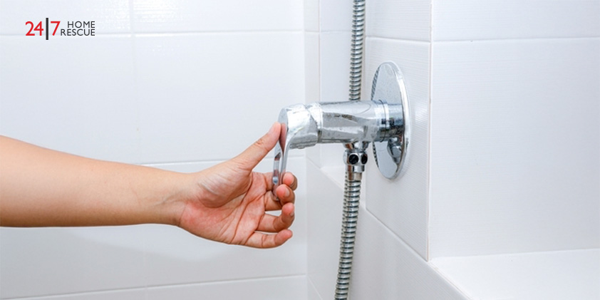hand grab shower valve handle in bathroom