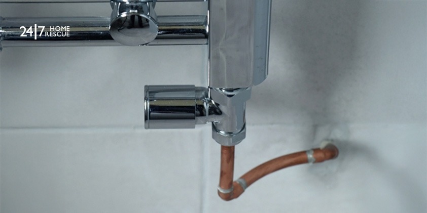 What is a Lockshield Radiator Valve? A picture showing a lockshield valve on a chrome radiator boiler