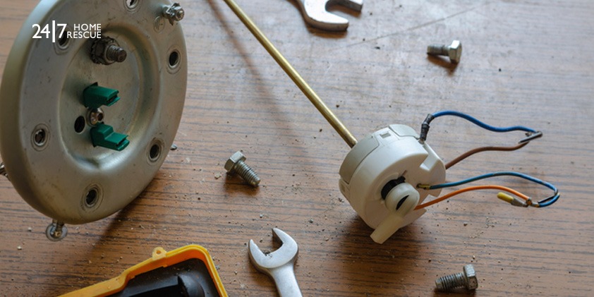 Various parts of a combi boiler on a table