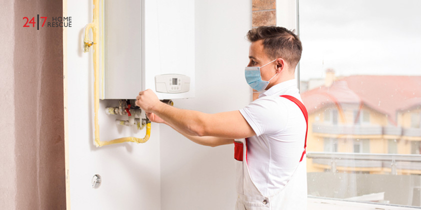 An engineer adjusting boiler pressure