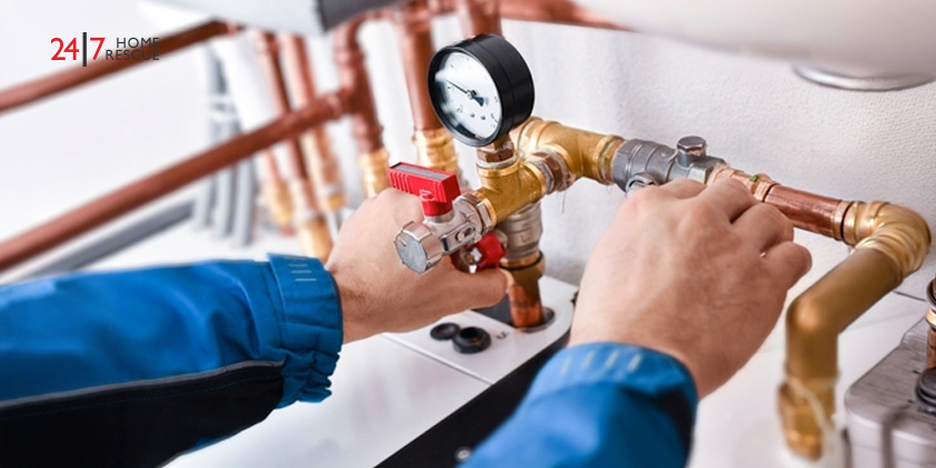 A gas safe engineer fixing a boiler
