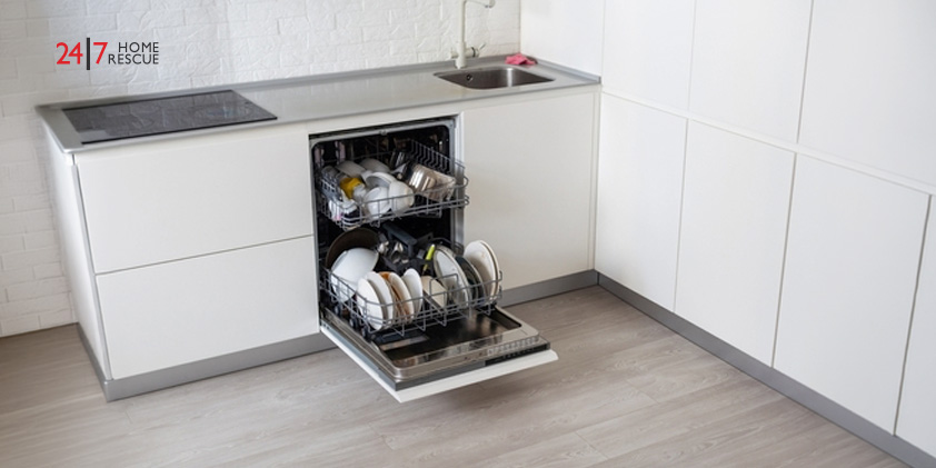 An open dishwasher with clean dishes placed inside