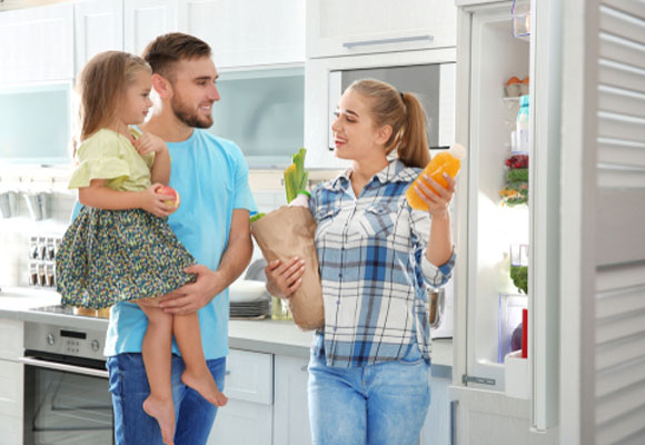 A family happy and satisfied with their home appliances
