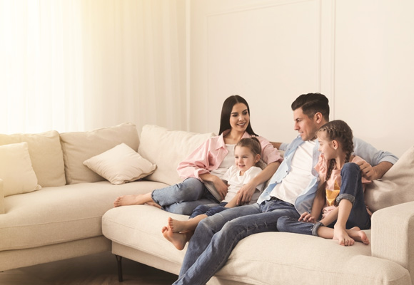 Family relaxing comfortably in a warm home