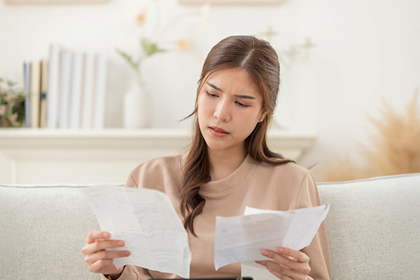 Woman-reviewing-boiler-cover-bills