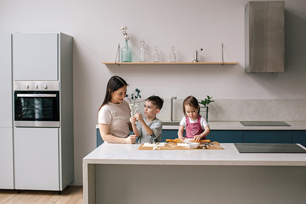 Family cooking together in kitchen