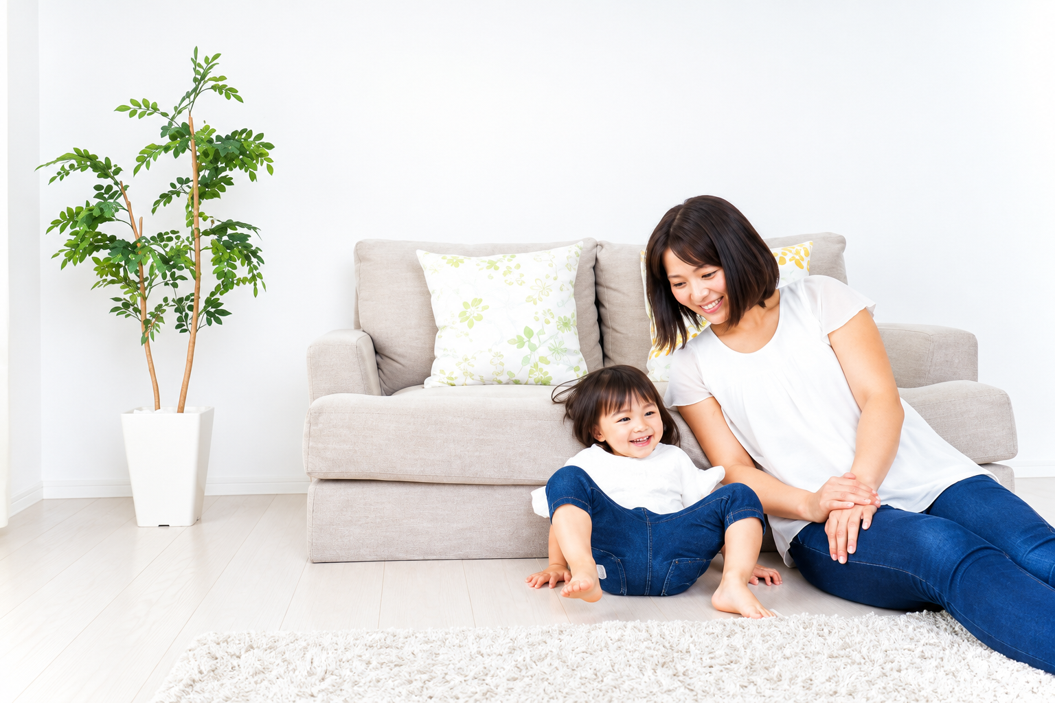 Mother and young child relaxing together in a bright comfortable living room